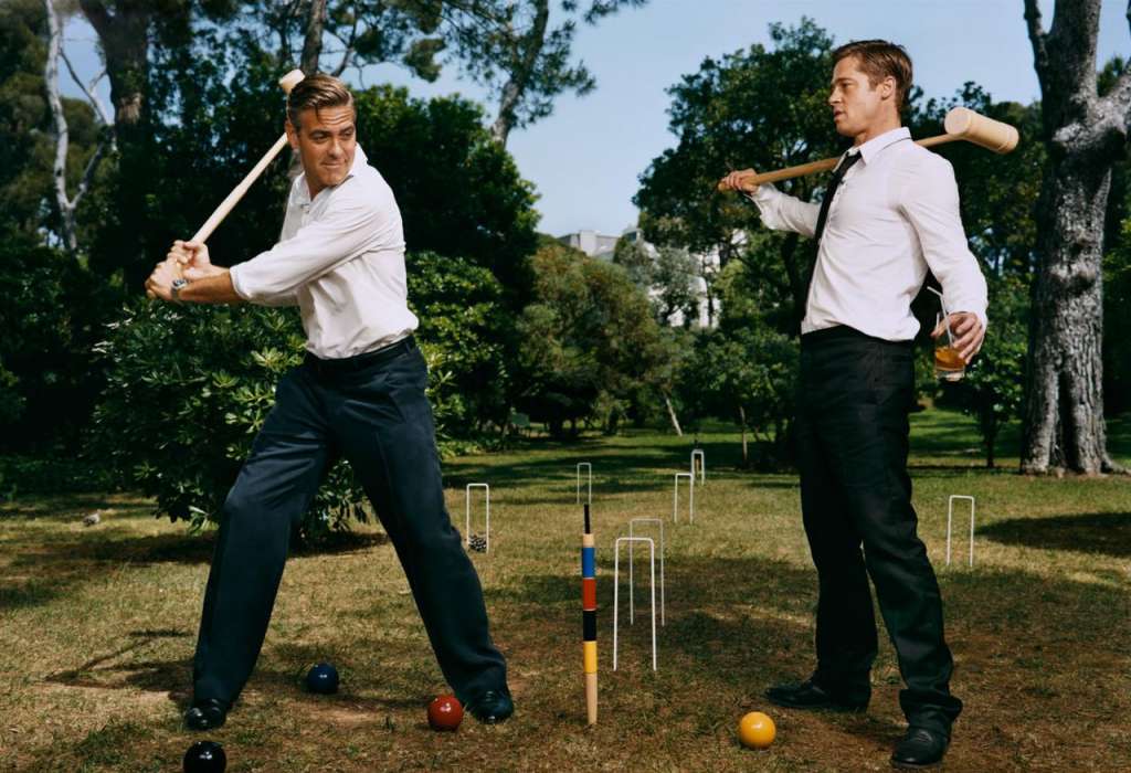 Two gentlemen playing croquet